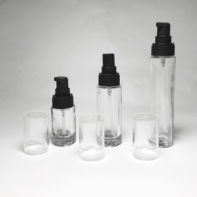 Travel size 35ml empty cylinder shape glass bottle custom spray color with black lotion treatment pump