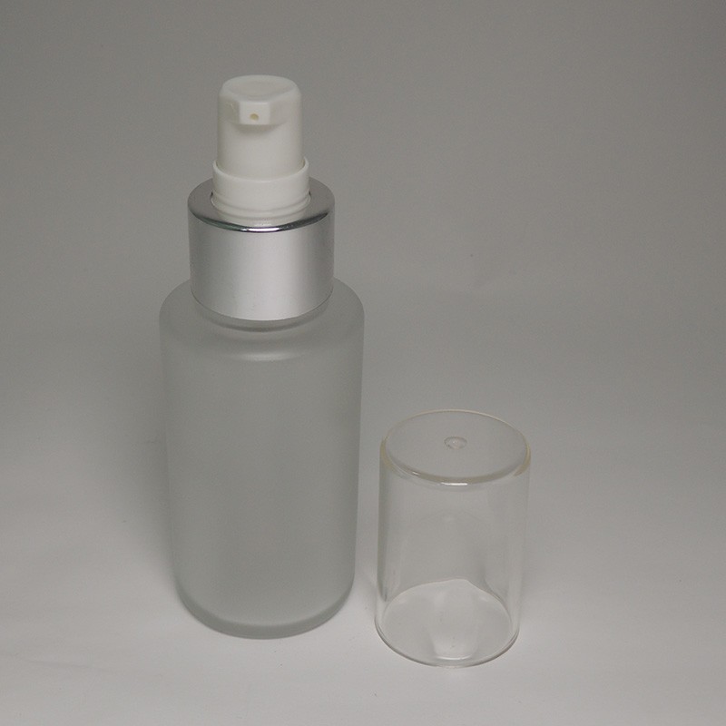 Moisturizing facial lotion empty 60ml glass bottle matte finish cylinder shape with cream/lotion pump 20/410 neck size